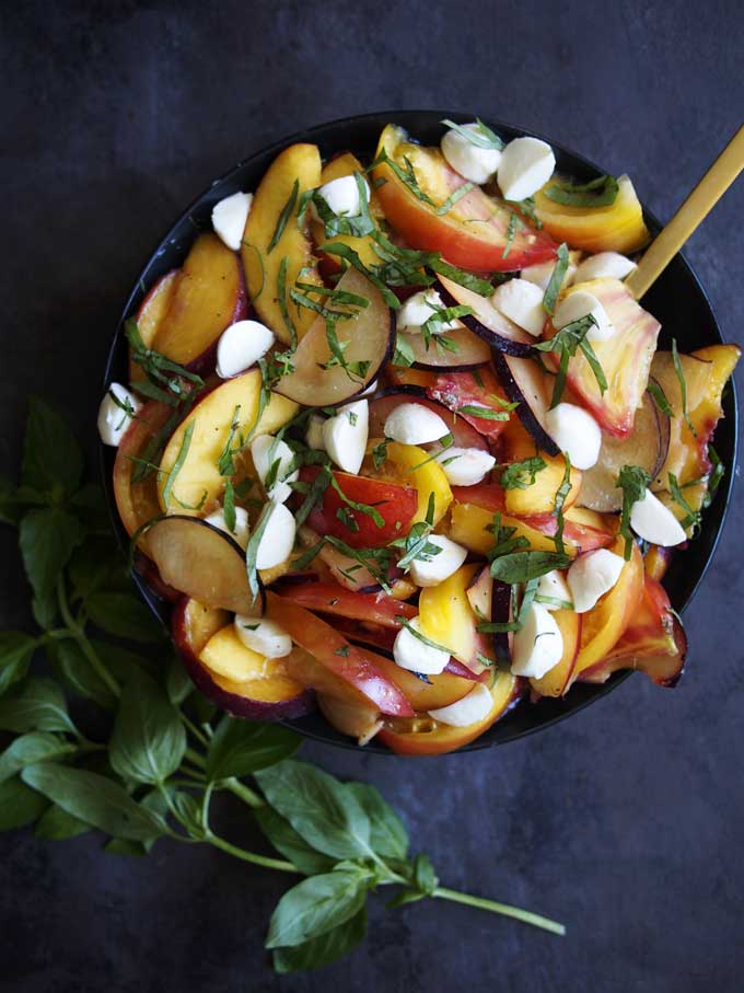 Stone Fruit Tomato Mozzarella Basil Salad Recipe | thekitchenpaper.com