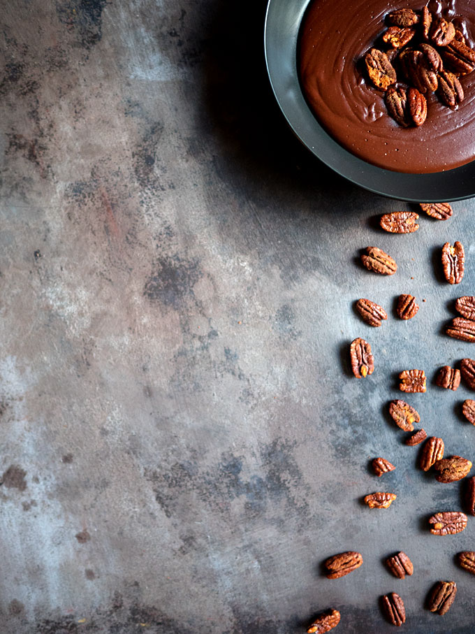 Warm Cocoa Pudding with Smoked Paprika Candied Pecans | thekitchenpaper.com